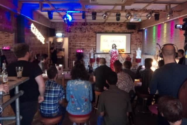 Emily Priest speaks to guests at the launch of her new book, Nicotine and Napalm.