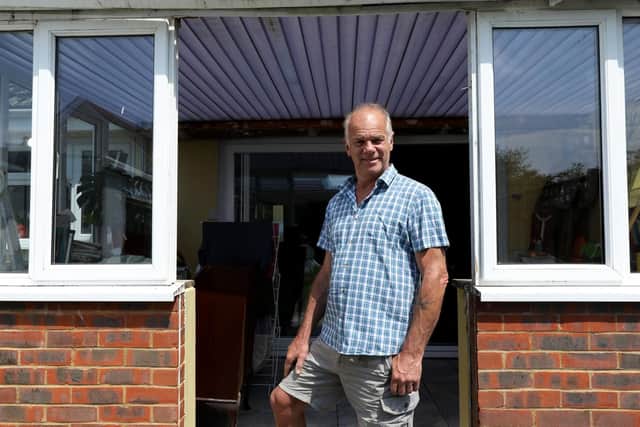 Phil Neville of Hayling Island, pictured in the space in the conservatory where his faulty B&Q French doors were meant to go.       Picture: Chris Moorhouse (260619-17)