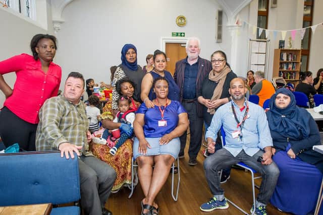 Pictured: Chairman of Friends Without Borders, Michael Woolley and volunteers with some of the asylum seekers and refugees in All Saints Church, Portsmouth. Picture: Habibur Rahman