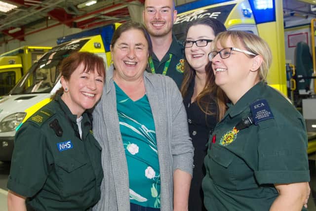Susan Sheppard with her daughter, Kim Piper, centre, with the paramedic team, Celine McCague, Justin Hurst and Natalie Andrews who saved Susan's life.
Picture: Habibur Rahman