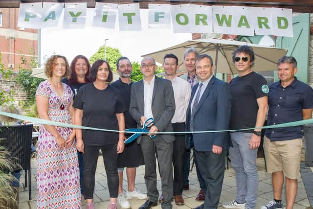 Assistant police and crime commissioner Enzo Riglia marks the opening of the Pay it Forward scheme, alongside caf staff and supporters. Picture: Habibur Rahman