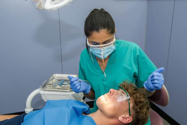 Harrison Brook, 16, being checked by Anika Parmar.
Picture: Habibur Rahman