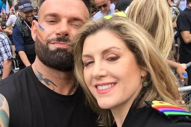 Defence secretary Penny Mordaunt pictured with her brother, James, at the London Pride event. Photo: Twitter.
