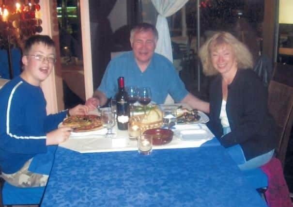 Happy families: Iain Shepherd, centre, pictured with his wife Mary and his stepson, Joshua in 2009. By this point he had almost stolen 58,000 of his Joshua's inheritance left to him by his late father.