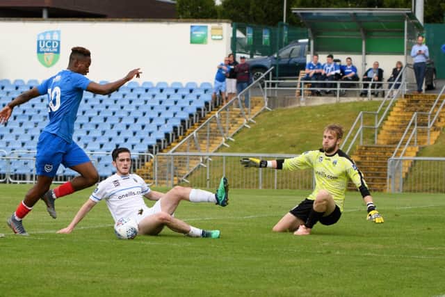 Jamal Lowe on the ball in UCD AFC's box