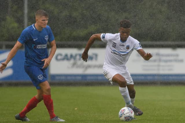 UCD AFC player runs with the ball