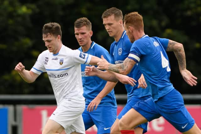 Sean Raggett, centre right, in action for Pompey against UCD   Picture: Arnold Byrne