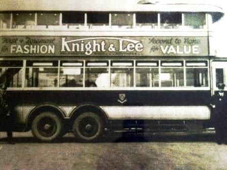 A bus advert for Knight and Lee from the early 20th century
