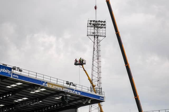 The old floodlights being taken down. Picture by Colin Farmery