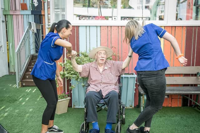 Leonard White, middle, dances with Cherish Matthews and Beth Ward. Picture: Habibur Rahman
