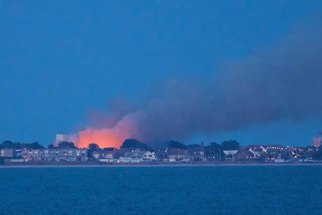 A fire at Browndown in Gosport set by 'idiots' on July 12 seen from Calshot beach. Picture: Jan Sutton