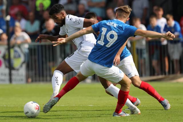 Hawks' Jonah Ayunga get pass Pompey's Joe Hancott
