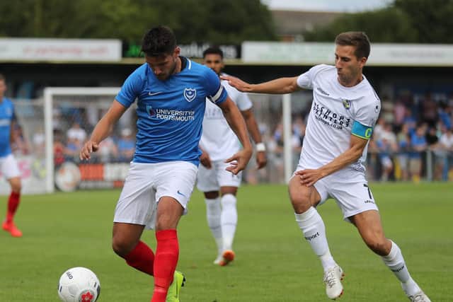 Pompey's Gareth Evans in action with Hawks' Wes Fogden