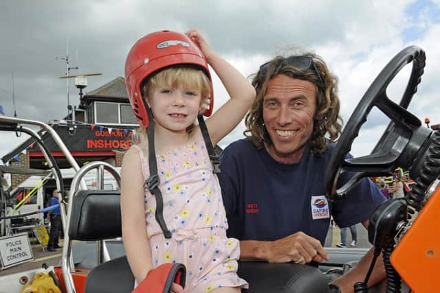 Ruby Randall (three), from Gosport with RNLI team member Matt Knight. Picture: Ian Hargreaves  (140719-5)