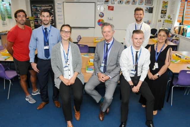 St Edmund's Catholic School in Portsmouth, has seven teachers and three support staff at the school which are ex pupils. (back l-r) Adam Poxton, head of PE, Jason Brown, head of Year 11, Joe Were, head of English and Jackie Robinson, data and assessment manager, with (front l-r) Jovanna Tuffnell, English teacher, Chris Nicol, R.E teacher and Leon Miller, teaching assistant. Three additional members of staff are not in the photograph due to absence or teaching commitments. Picture: Sarah Standing (110719-)