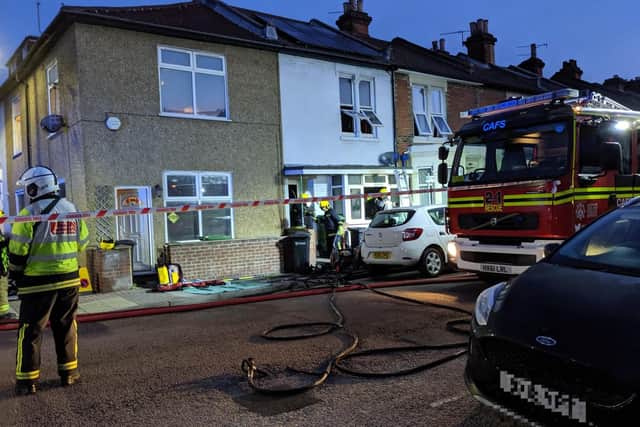 Firefighters at the scene of a house fire in Fawcett Road, Southsea, in the early hours of Tuesday, July 16. Picture: Callum Slater