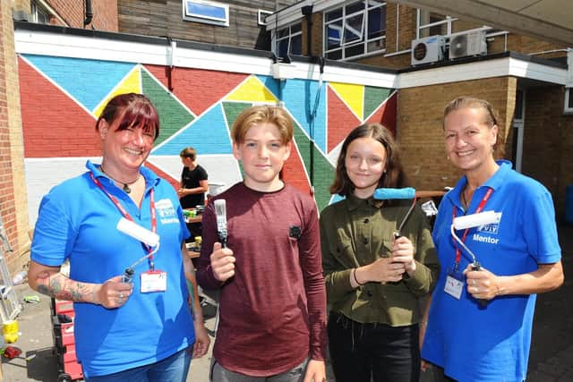 Pupils have created a new school mural. Pictured (left to right) Volunteer it Yourself mentors Kate Buxton and Kate Kerr with Mackenzie Wickham (13) and Katie Bourner (12).

Picture: Sarah Standing (120719-952)