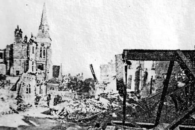 The remains of Knight & Lees store after the night of January 10, 1941. The spire of St Judes Church is on the left.