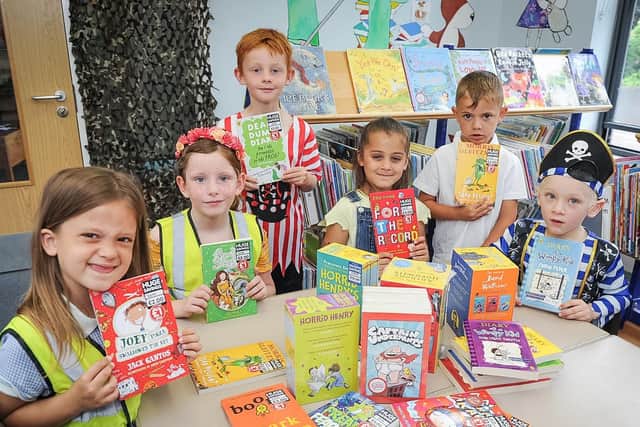 Grange infant school pupils, Lly 7, Marlee 7, Sam 6, Leah 6, Charlie 5 and Nathan, 6, at the school library with their favourite books.
Picture: Habibur Rahman