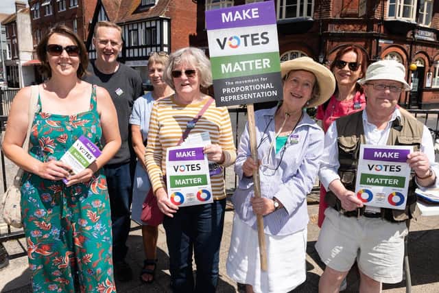Philippa Gray, third-right, joins campaigners including Caroline Osbourne of Make Votes Matter to demonstrate for proportional representation. Picture: Duncan Shepherd