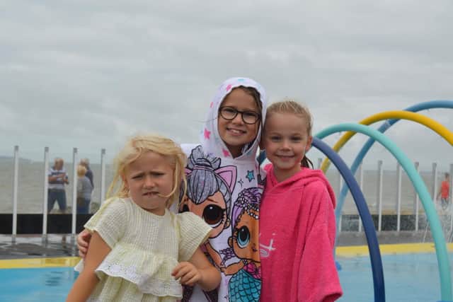 From left, Isla Codling (5), Freya Codling (8) and Ava Jackson (8) at the new splash park. Picture: David George