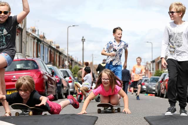 The Billson and Terry children play in the road as Francis Avenue, Portsmouth, becomes a play street. Picture: Chris Moorhouse. (210719-59)