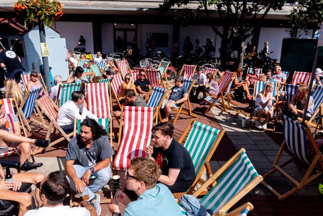 Festival-goers relaxing in the deck chairs. (200719-016)