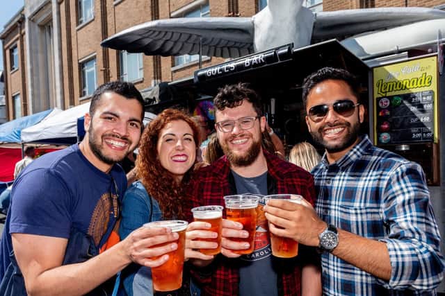 Akshaya Chapagain, Marta Gallego, Edward Fraser and Rajeev Bhandari says cheers with their Hop House 13 lager. All were students at University of Portsmouth five years ago and came back to Portsmouth to see each other and the city again. (200719-015)