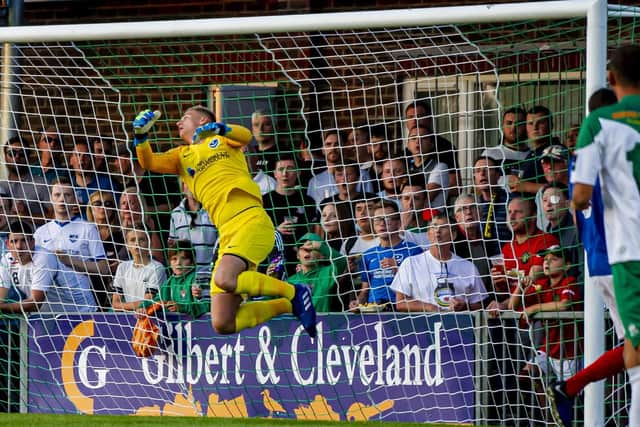 Alex Bass, seen here pulling off a save against Bognor last week, will feature for a young Pompey XI against Aldershot tomorrow night. Picture: Tommy McMillan