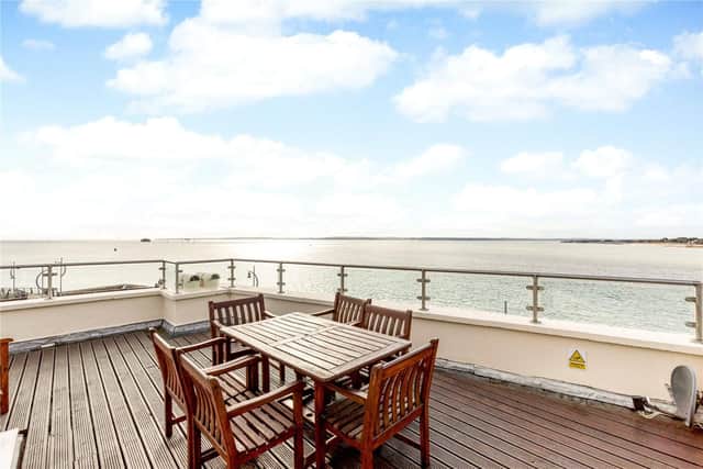It has a roof terrace, basement, and three en-suite bedrooms. It is listed on the market by Hamptons International - Chichester.
