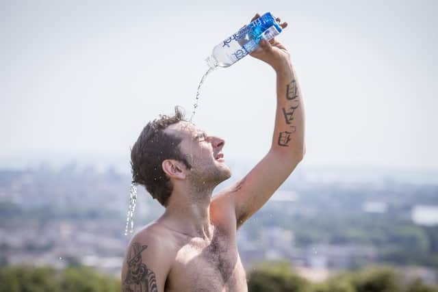 Jason Cowlishaw was cooling off at Portsdown Hill with some water. Picture: Habibur Rahman