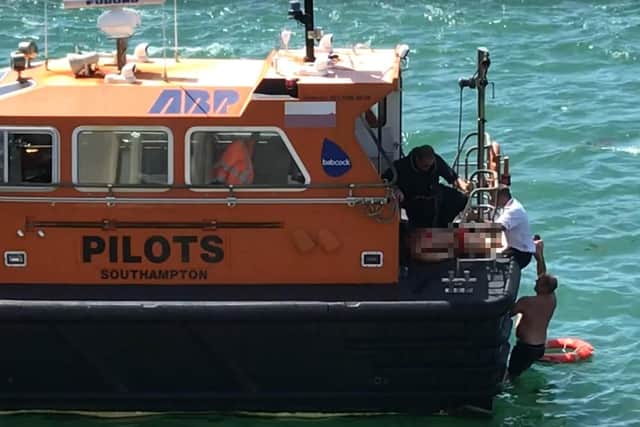 Video caught the moment a woman and her two children were rescued at Portsmouth Harbour