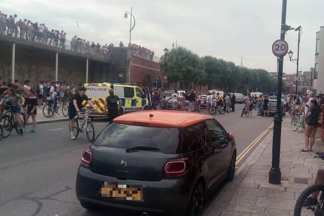 Youths at the Hotwalls in Old Portsmouth on July 25 at around 4.40pm as police are seen making an arrests.