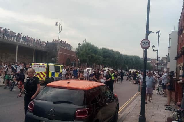 Youths at the Hotwalls in Old Portsmouth on July 25 at around 4.40pm as police are seen making an arrests.