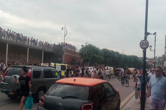 Youths at the Hotwalls in Old Portsmouth on July 25 at around 4.40pm as police are seen making an arrests.