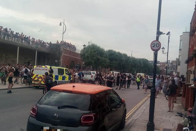 Youths at the Hotwalls in Old Portsmouth on July 25 at around 4.40pm as police are seen making an arrests.