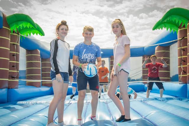 Lyla, Charlie and Faith 15 playing Bouncy castle beach ball. Picture: Habibur Rahman