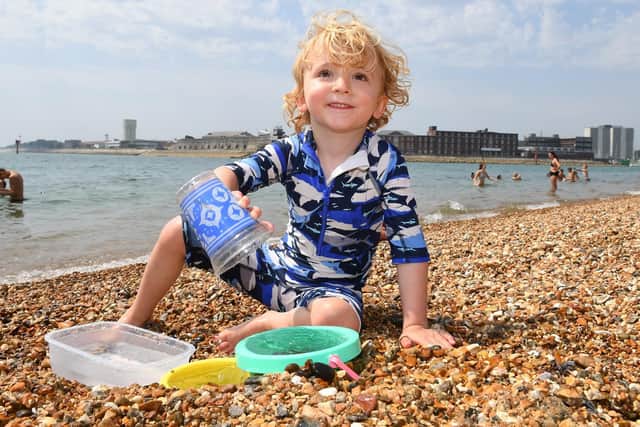 Great fun for Edward Atwill (4) from Old Portsmouth, sea water and a few pots..... he needs no more !