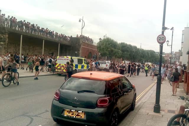 Youths at the Hotwalls in Old Portsmouth on July 25 at around 4.40pm as police are seen making an arrests.