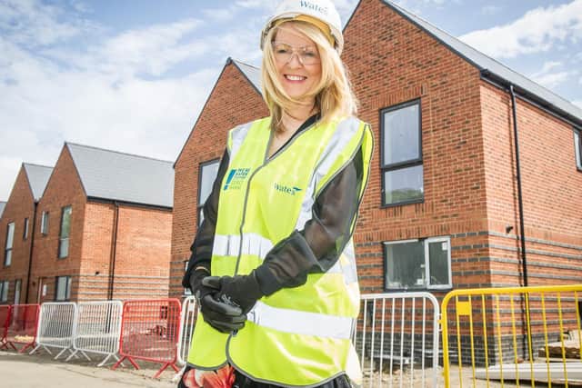 Esther McVey in front of some of the houses being made in the construction site at Daedalus, Lee-on-Solent.
Picture: Habibur Rahman.