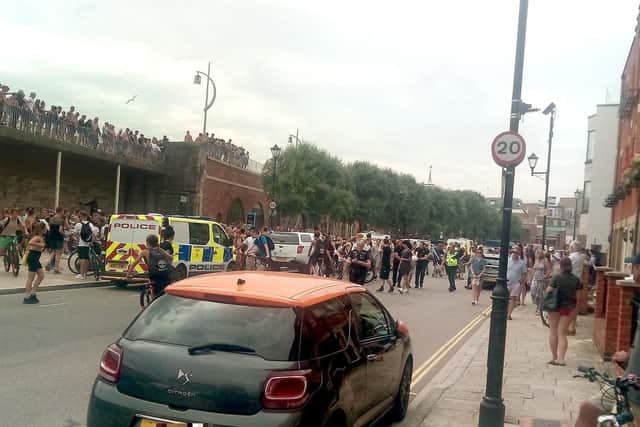 Youths at the Hotwalls in Old Portsmouth on July 25 at around 4.40pm as police are seen making an arrests