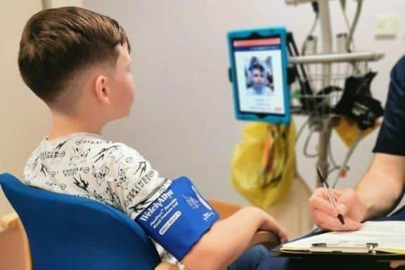 A youngster using the Lifelight app to get his vital signs checked. Picture: Portsmouth Hospitals NHS Trust