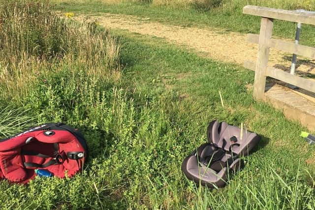 Car seats left by travellers at Hampshire Farm Meadow, Emsworth, on Sunday, July 28.