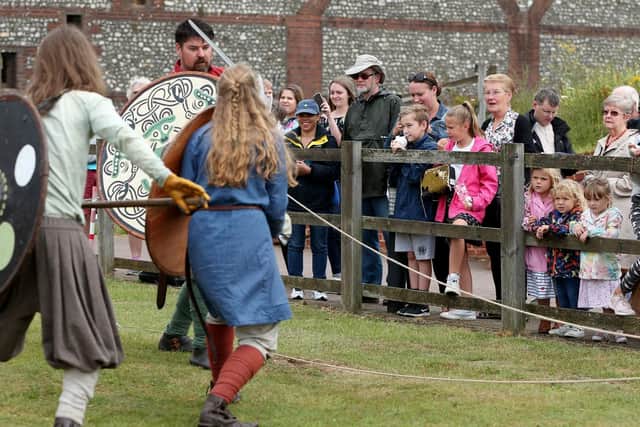 Watching the battle. Invasion! Saxon warriors event at Fort Nelson. Picture: Chris Moorhouse (270719-47)