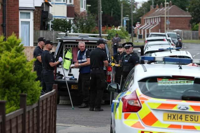 Police at the scene of the house fire in Grange Crescent, Gosport. Picture: Chris Moorhouse (310719-89)