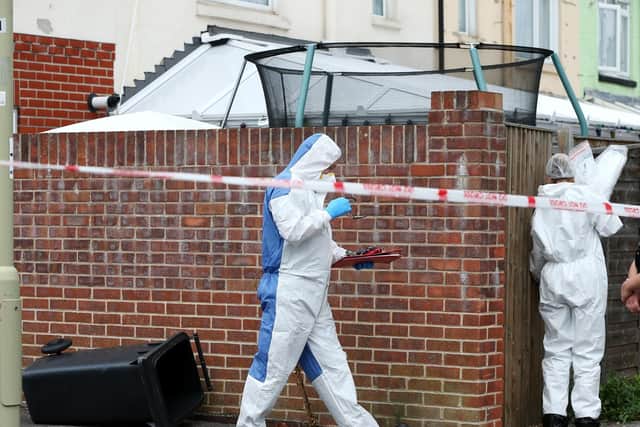 Forensics specialists at the scene of the house fire in Grange Crescent, Gosport. Picture: Chris Moorhouse (310719-83)