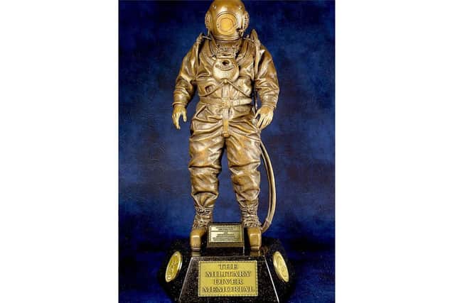 A copy of the bronze statuette that is one of 300 being sold to help fund the project to build the national memorial