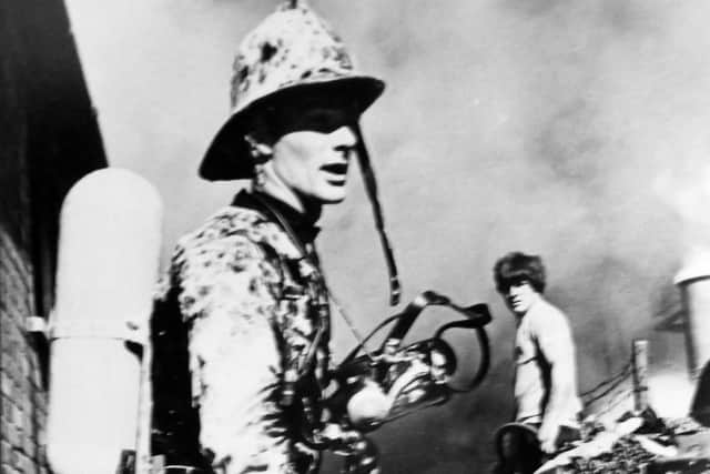 Fireman McGrail covered is covered in foam after a fire at a Hilsea engineering firm caused 20,000 worth of damage. Photo: Roy West.