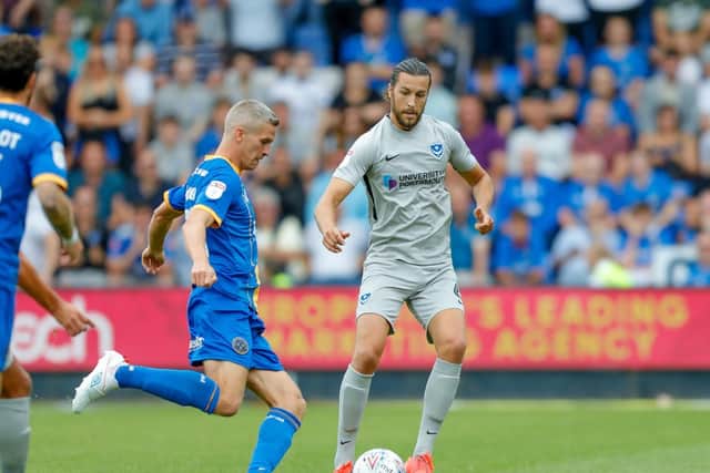 Shrewsbury Town forward Steve Morison (20), on loan from Preston North End, and Portsmouth defender Christian Burgess (6)