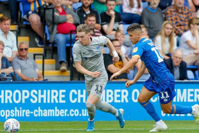 Portsmouth midfielder Ronan Curtis (11) battles for possession
